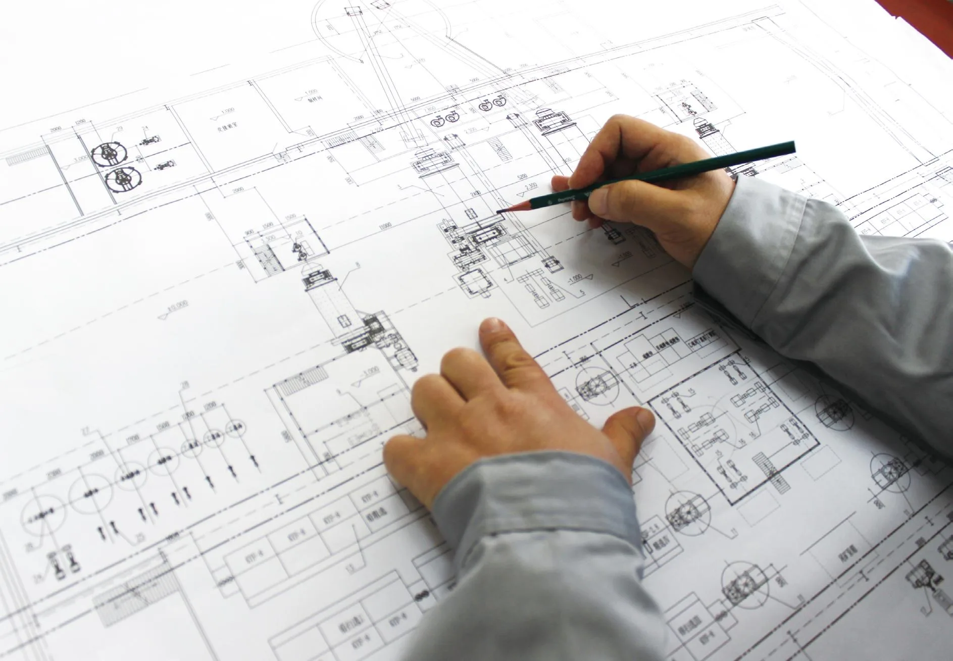 Engineers reviewing tailings storage facility design drawings for a mine project